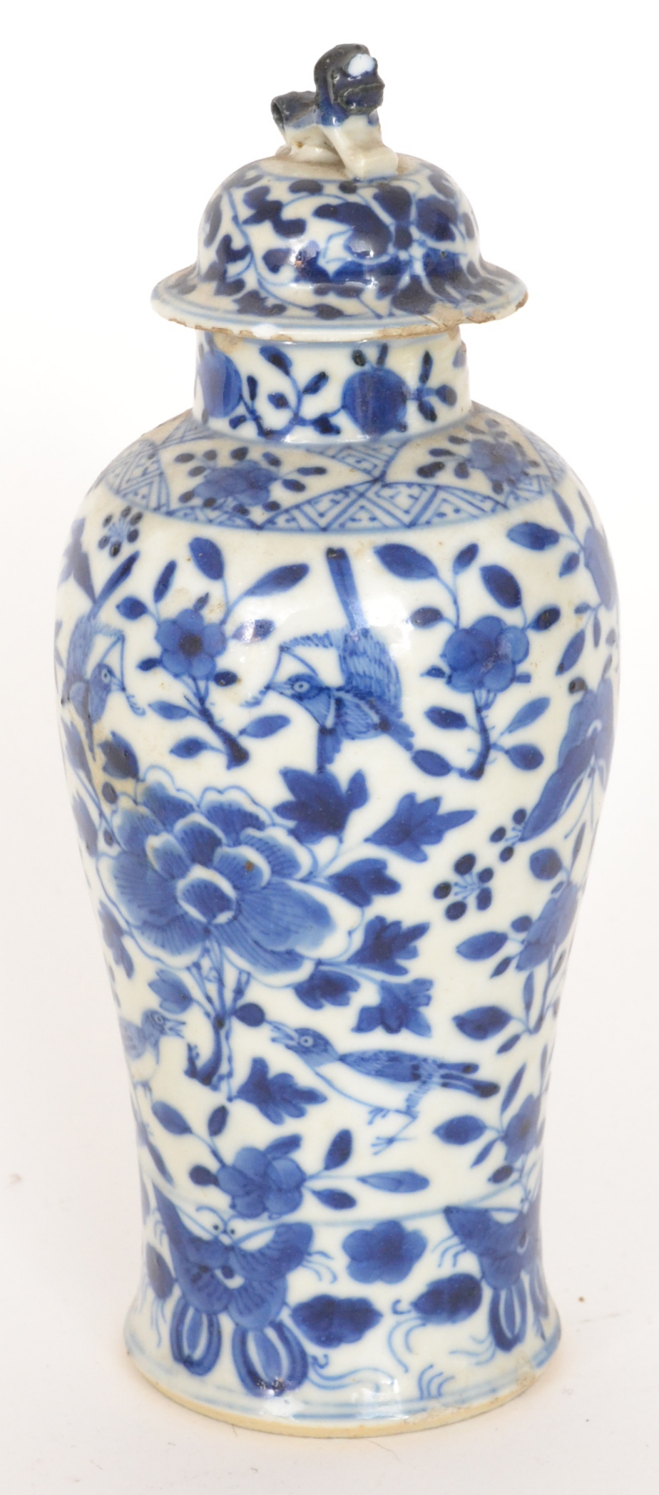 A late 19th to early 20th Century Chinese blue and white vase and cover, the body decorated with
