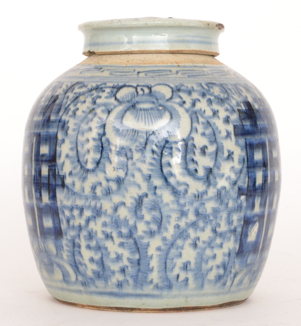 An early 20th Century Chinese blue and white ginger jar and cover decorated with stylised floral