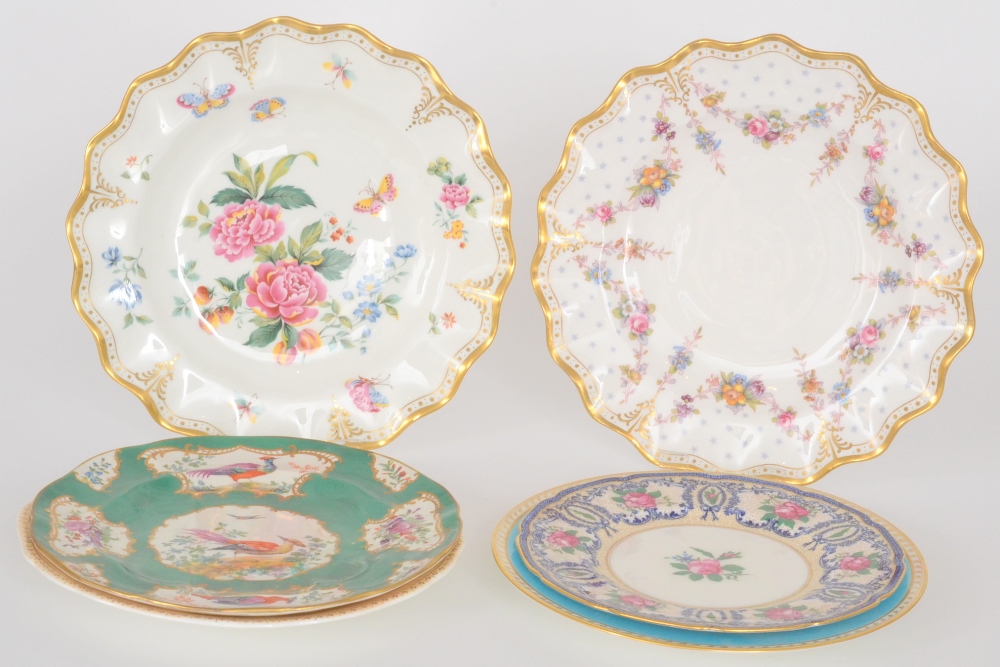 A Royal Crown Derby `Derby Days` frilled edge plate decorated with floral sprays together with a