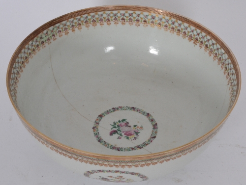 A large 19th Century Canton enamel bowl decorated with floral roundels and floral sprays against a