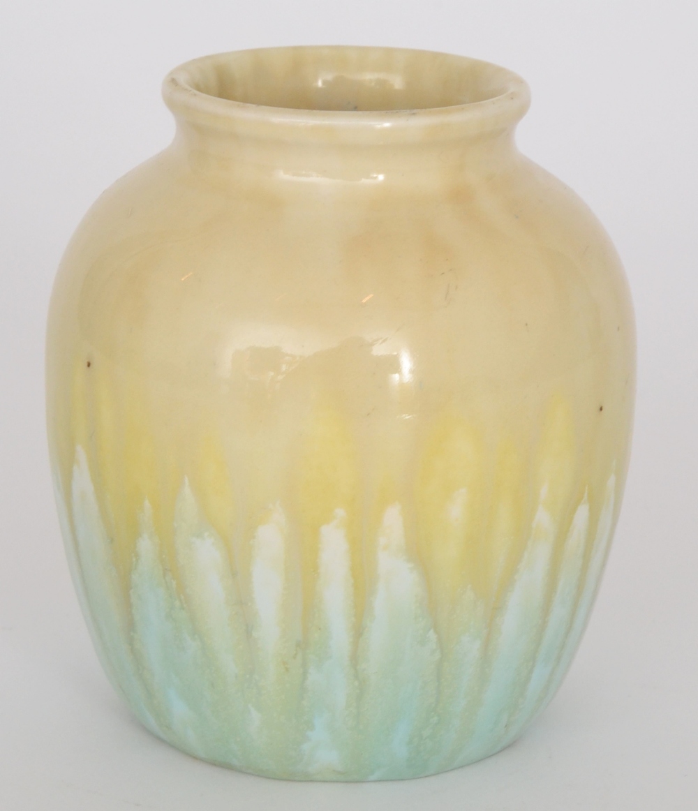A Ruskin Pottery vase of ovoid form decorated in an all over dribble yellow over celadon green