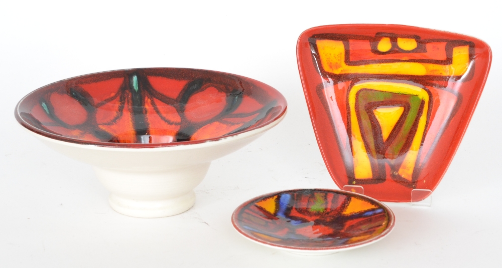 Three pieces of Poole Pottery Delphis pattern to include a footed bowl, a shape 49 pin dish and a