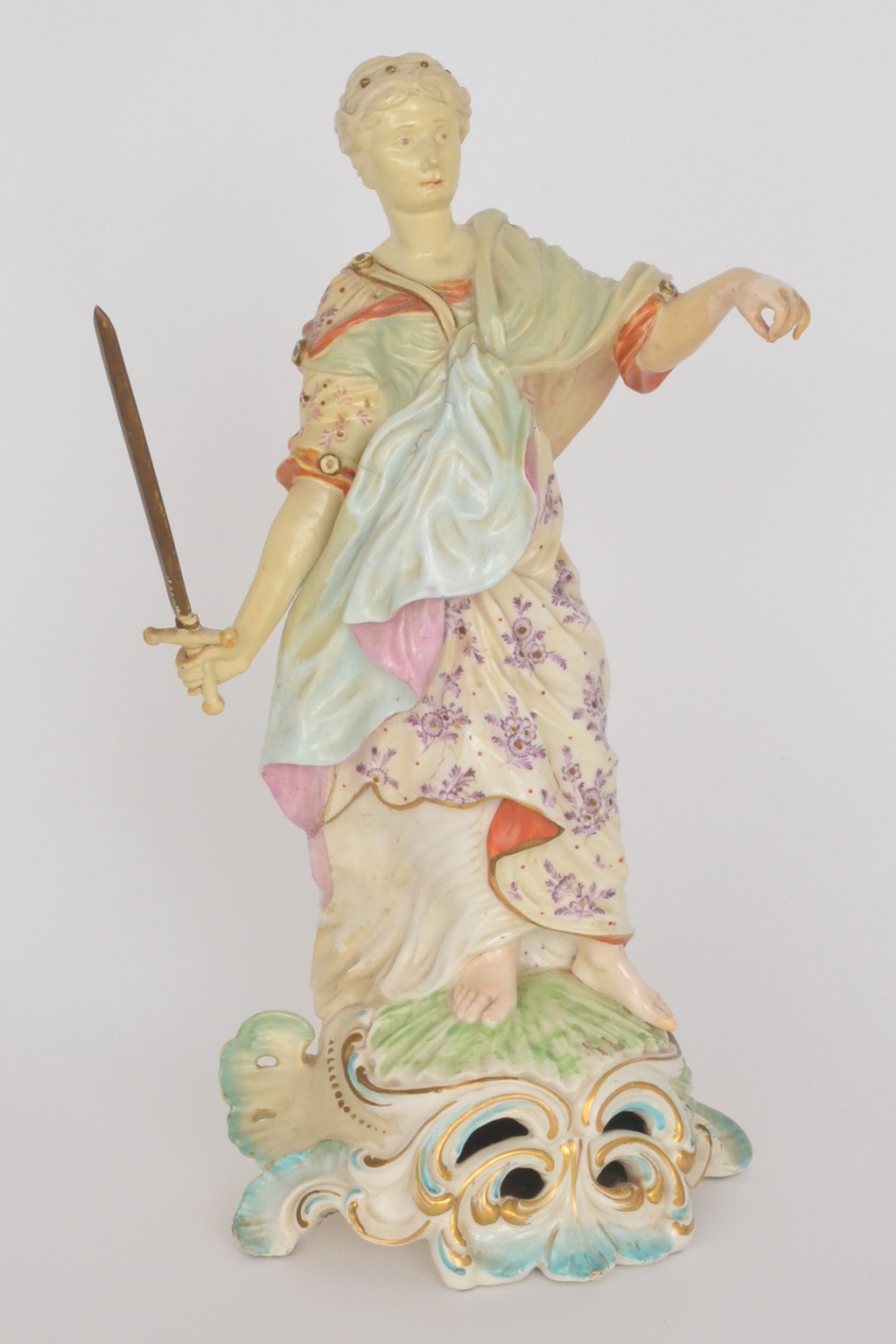 A late 18th Century Derby figure of Justice modelled in flowing classical robes with sword in