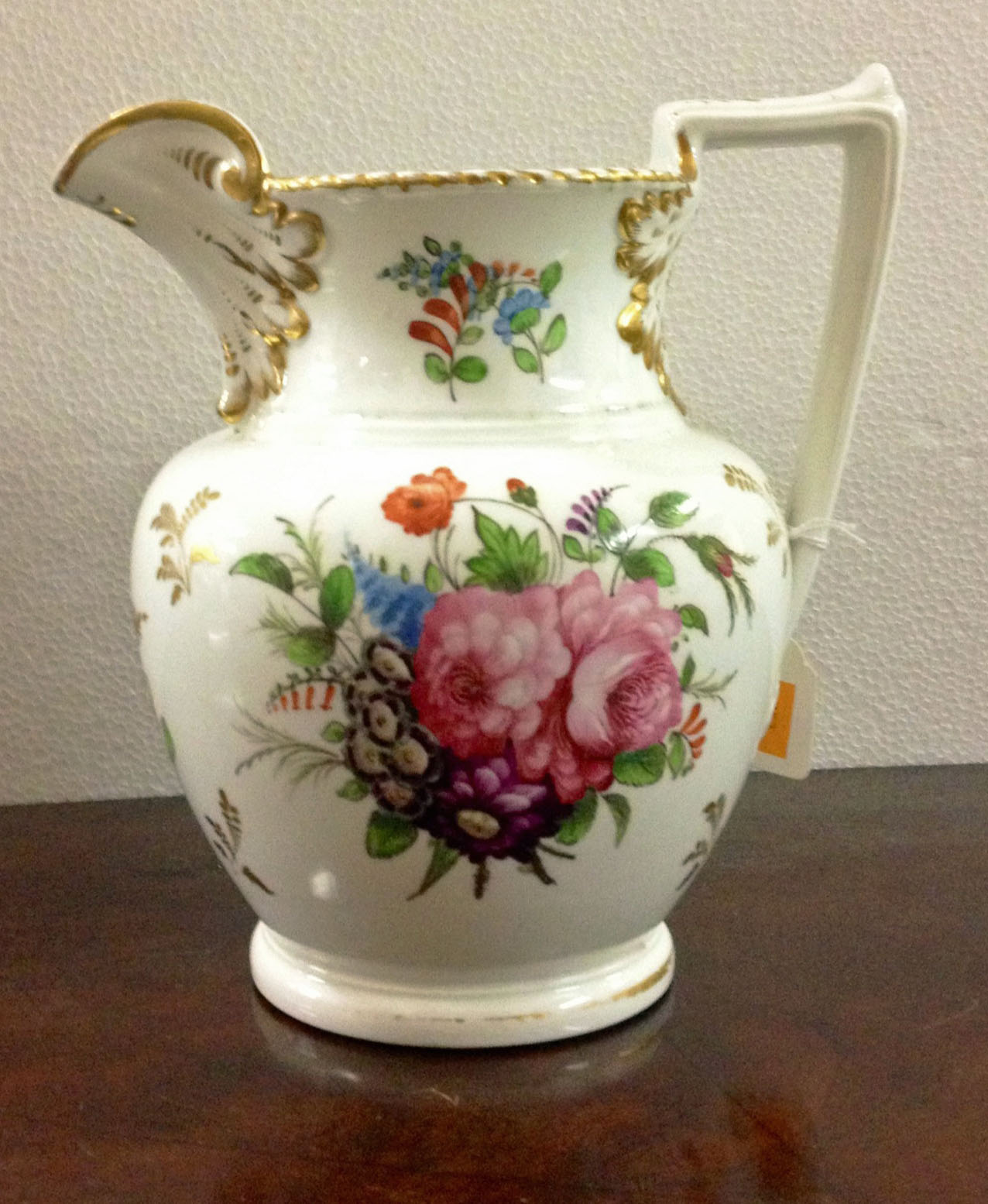 A very good large 19th Century English porcelain Jug, finely hand painted with bouquets of