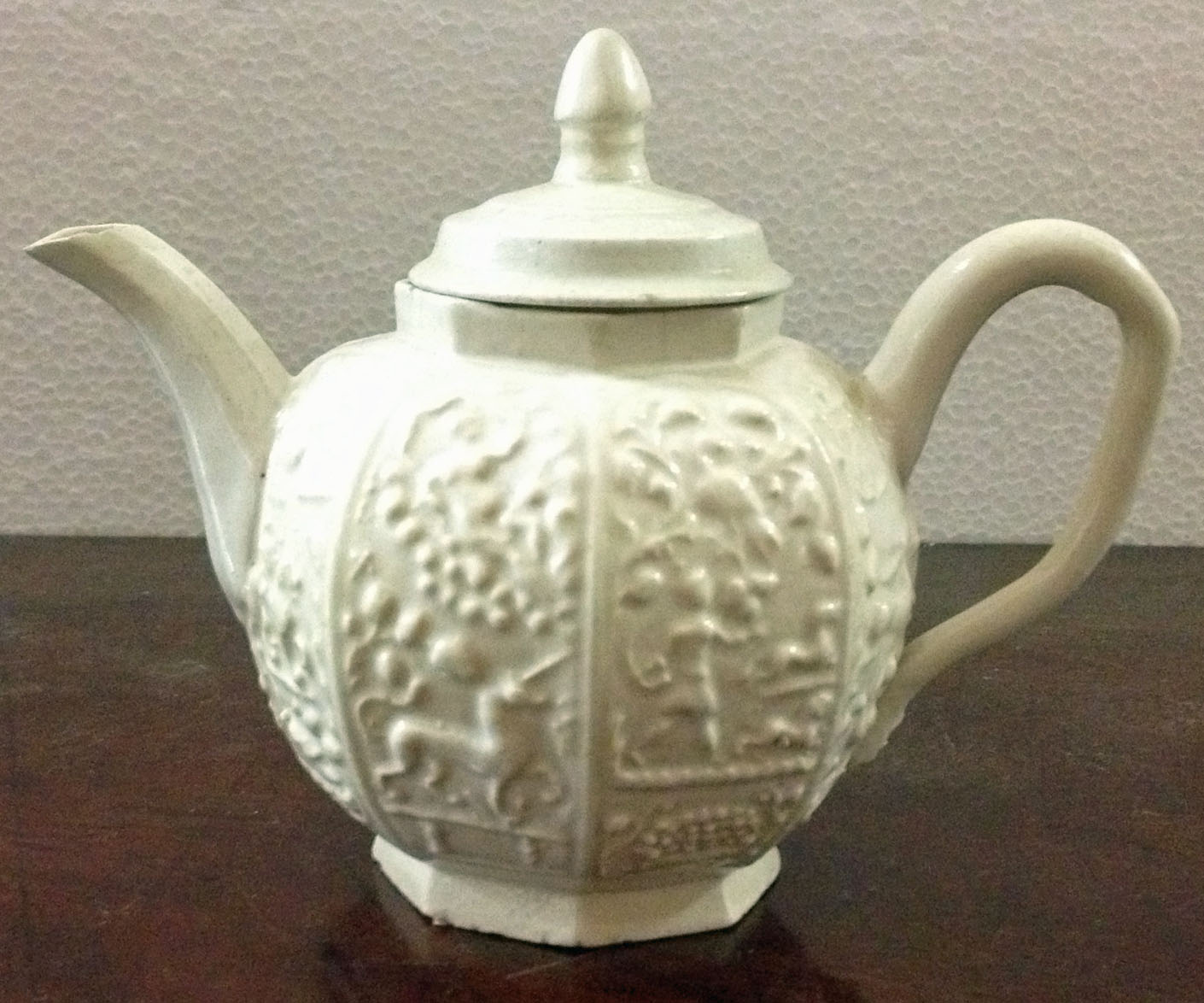 A rare antique  salt glazed decorated white porcelain miniature Teapot and cover. (1)