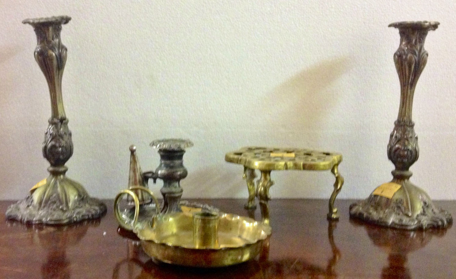 A pair of Victorian plated Chambersticks and snuffers; a pair of plated Candlesticks; a brass