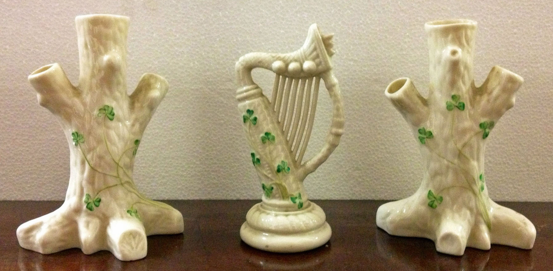 A pair of modern Belleek shamrock Trunk Vases, and a harp, 15cms (6") high. (3)