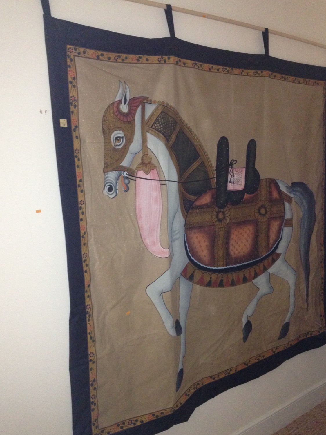 An attractive hand painted Indian Wall Hanging, depicting an imperial horse with saddle, 163cms x