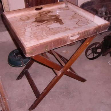 A large antique brass bound mahogany Butlers Tray, on stand. (1)
Also includes: a damaged mahogany