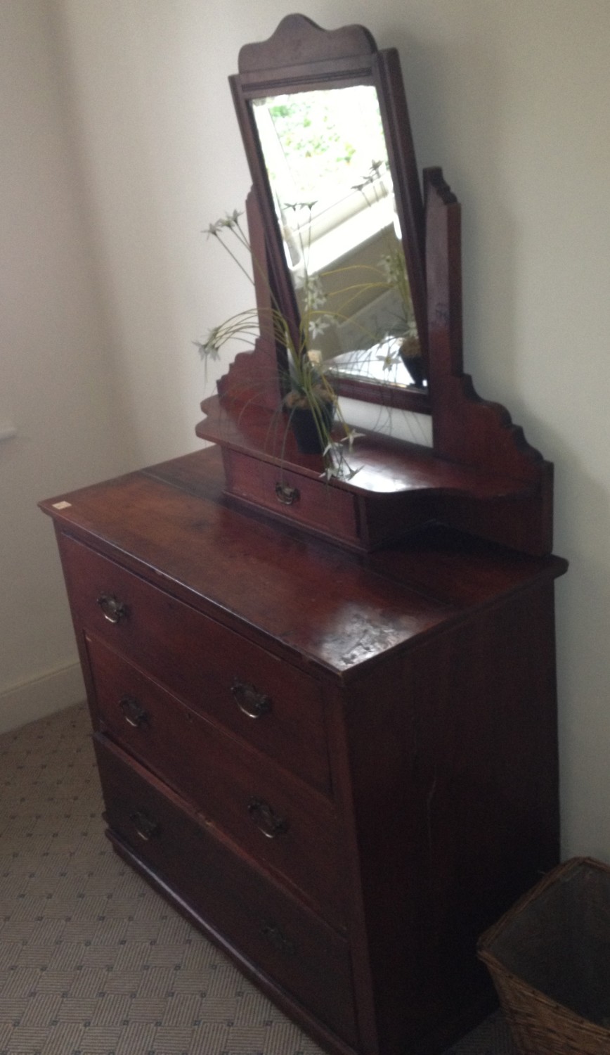 An Edwardian stained wooden Dressing Table / Chest, with swing frame mirror, and an oak Bedside