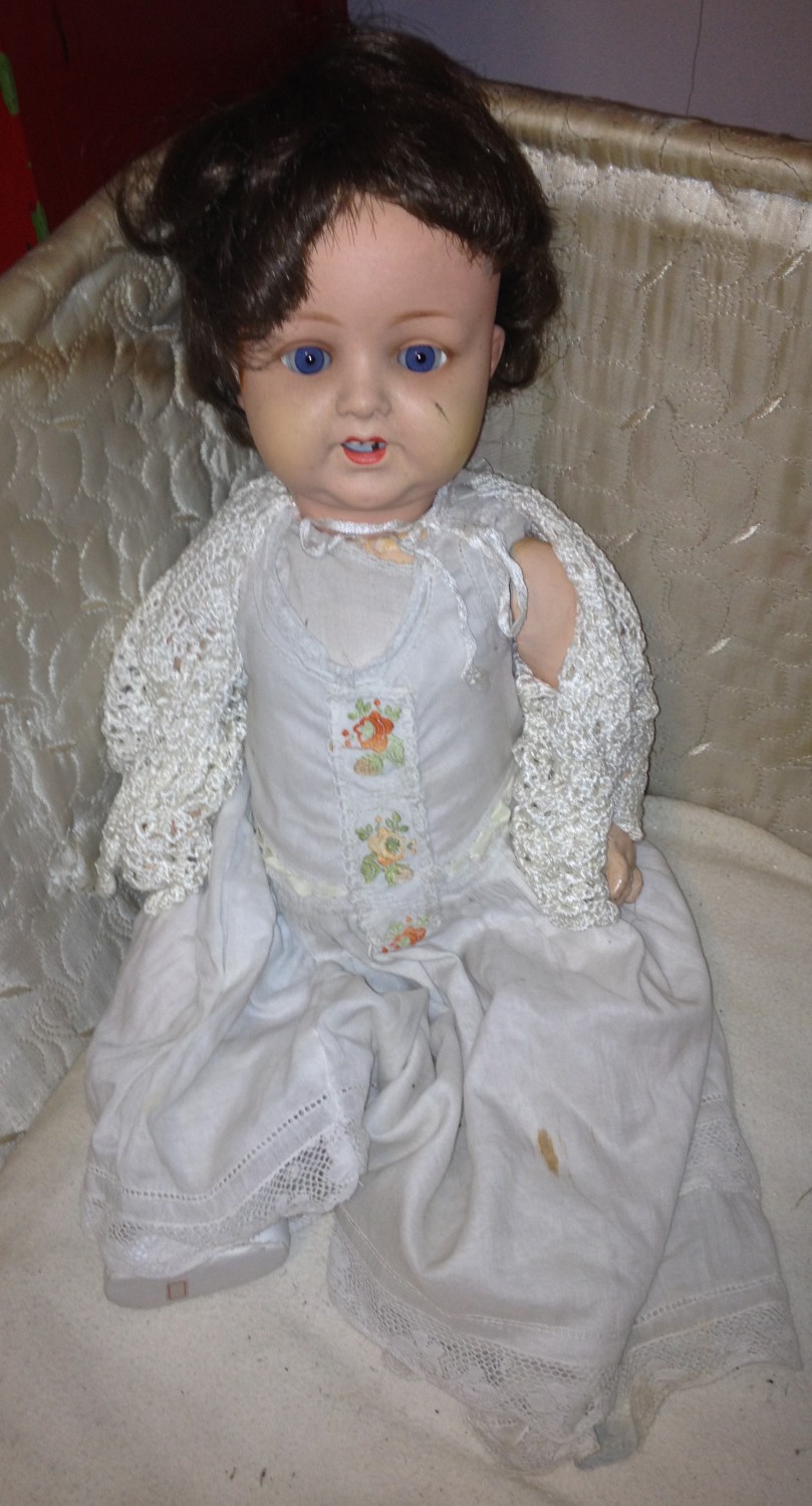 A good Edwardian German Baby Doll, with long lace trimmed dress, crochet cardigan, slippers with