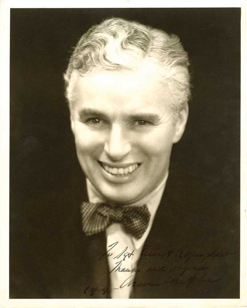 CHAPLIN, CHARLIE Photograph Signed - (SP) A vintage matte-finish 8x10" photograph of the middle-aged