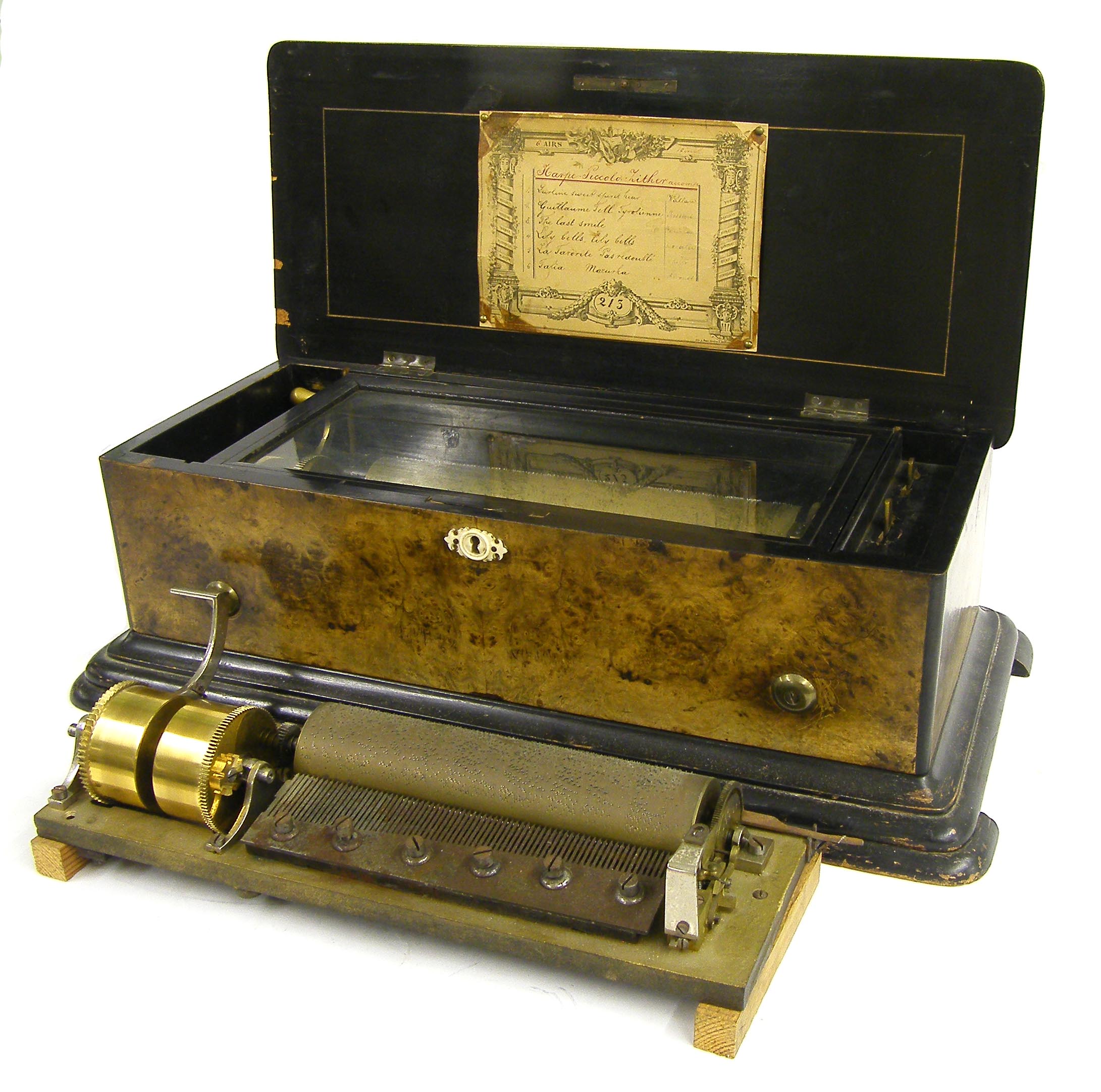 Swiss music box, the 11" cylinder playing on six airs, with original tune sheet and stamped no. 213,