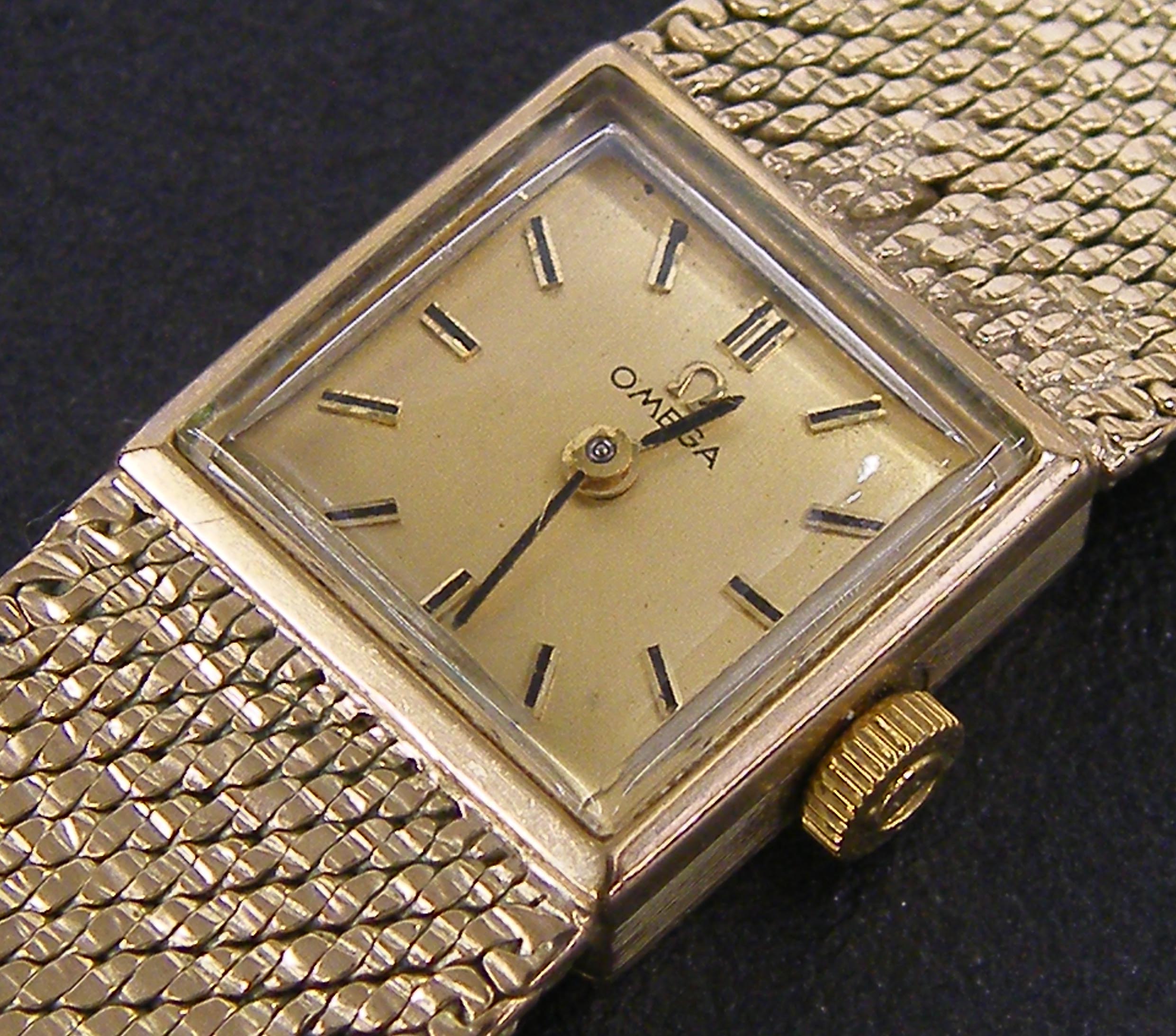 Omega 9ct lady`s bracelet watch, the square gilt dial with baton markers, cal. 484 17 jewel