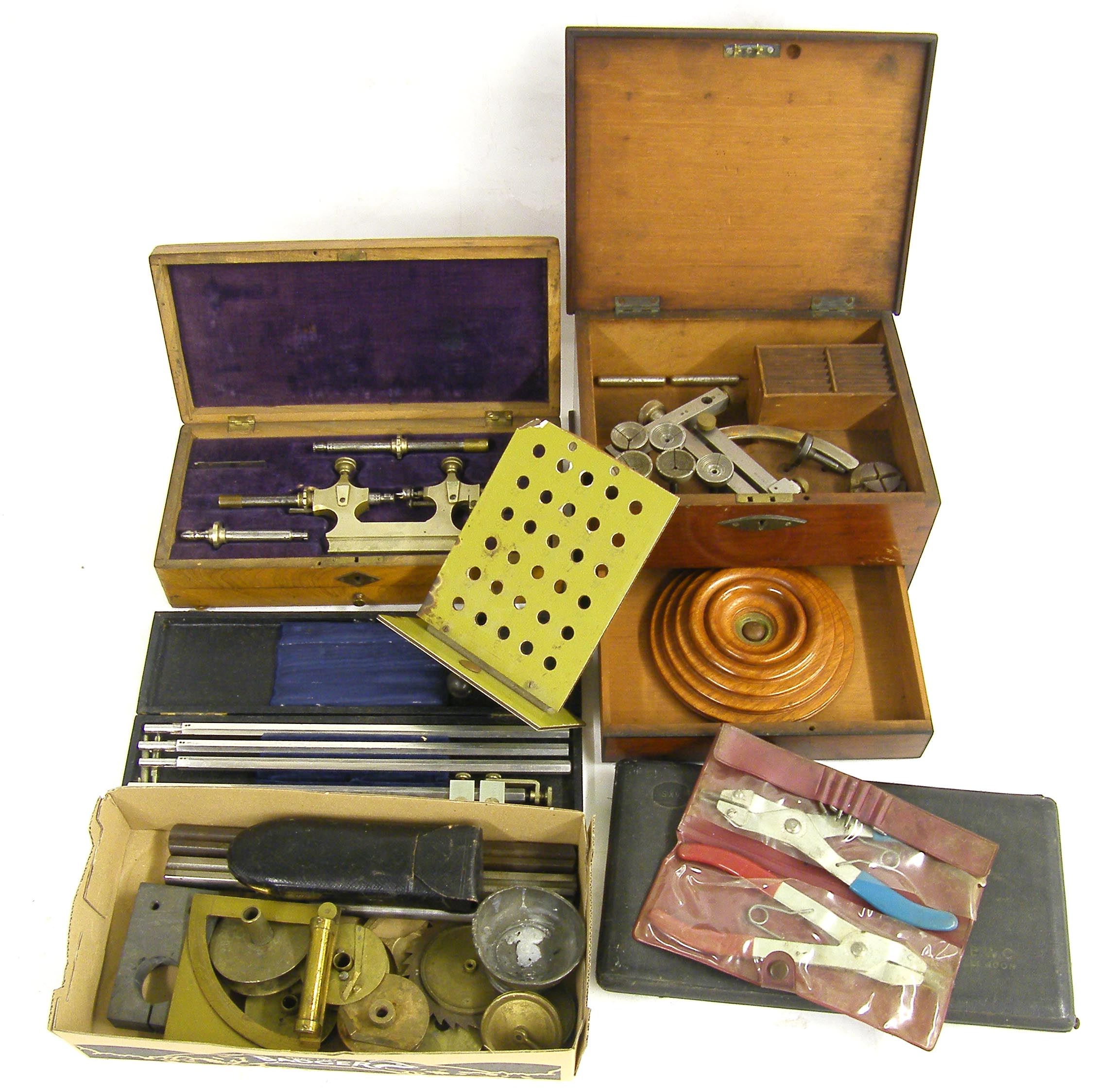 Small quantity of clock related tools and parts, to include Jacot type tool within a fitted wooden