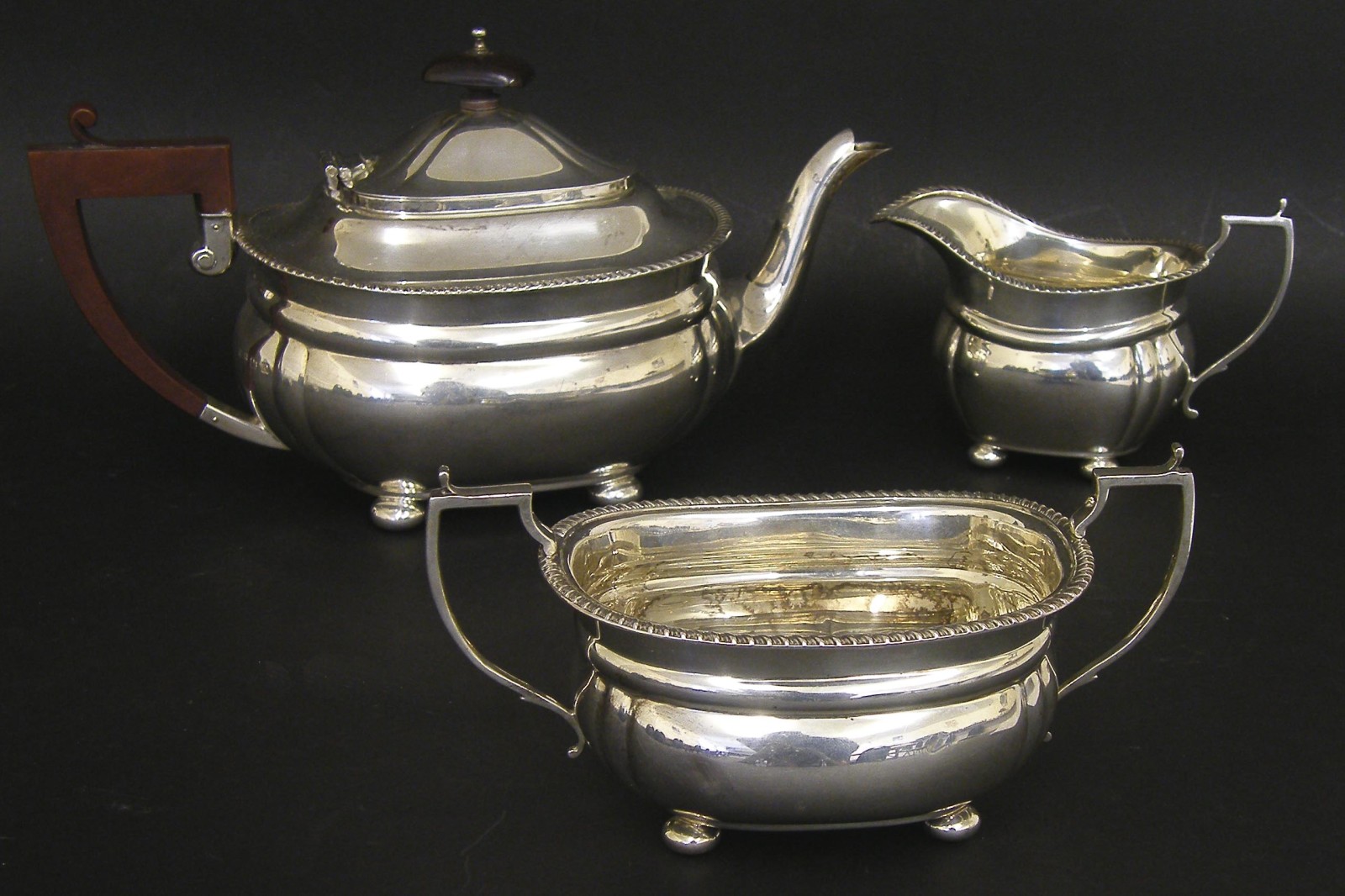 1930s silver three piece boat shaped tea service, comprising teapot, milk jug and twin handled