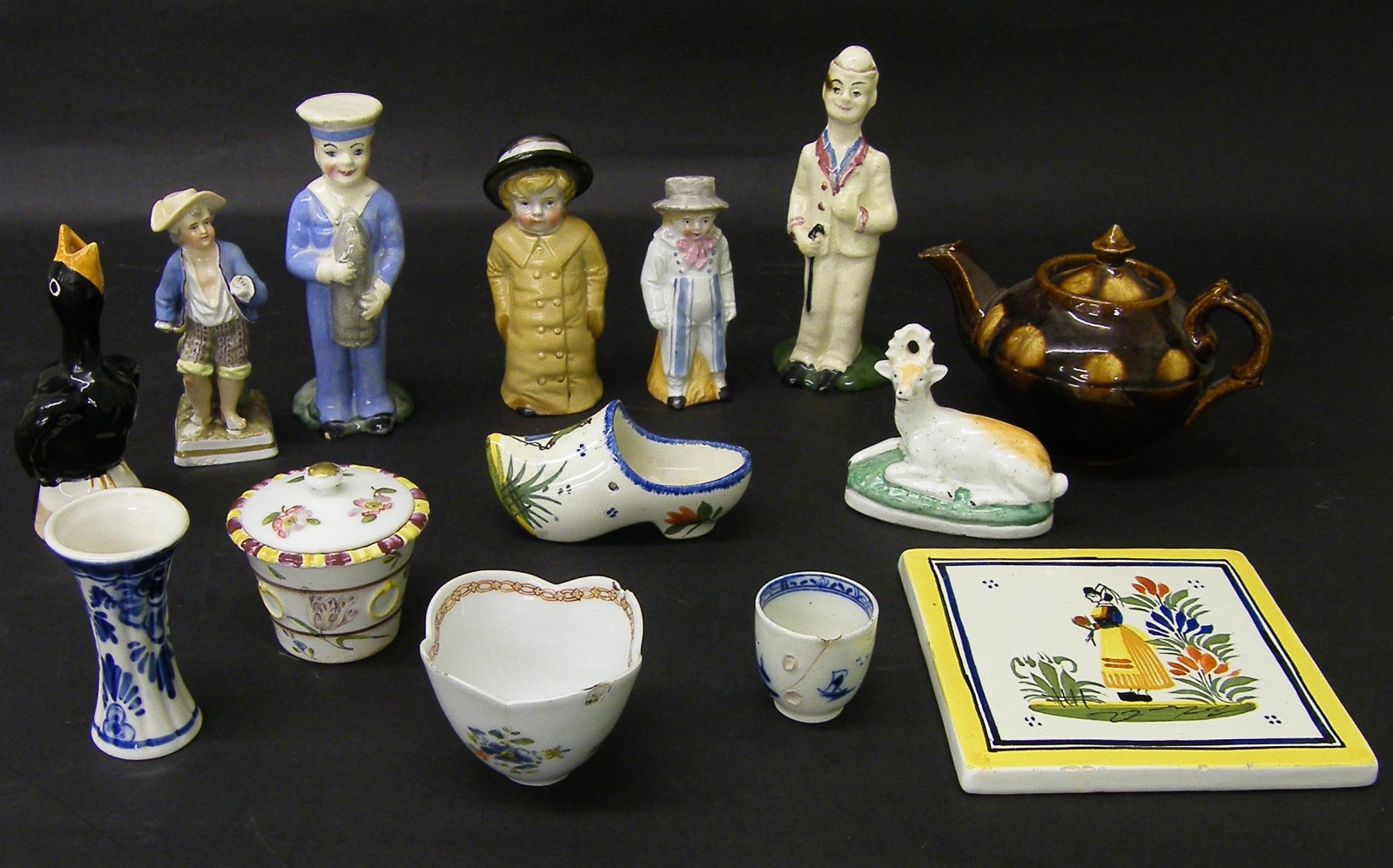 Collection of decorative ceramics to include character figurines, Delft tile and clock etc