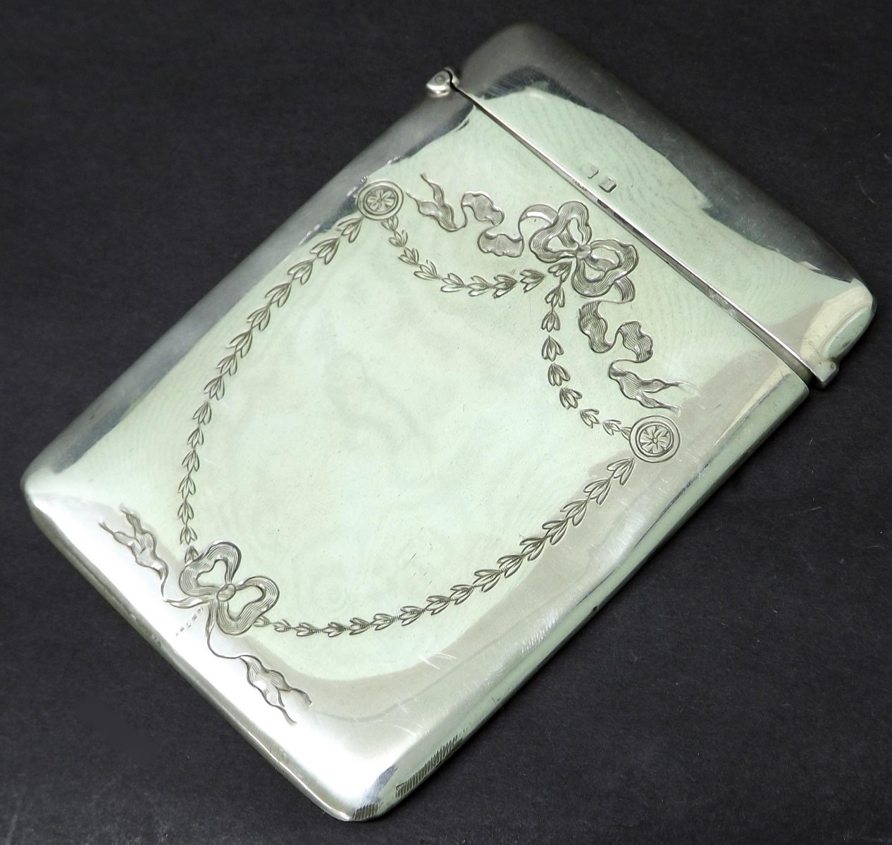 George V silver card case with hinged lid and engraved with ribbon borders, maker WN, Birmingham