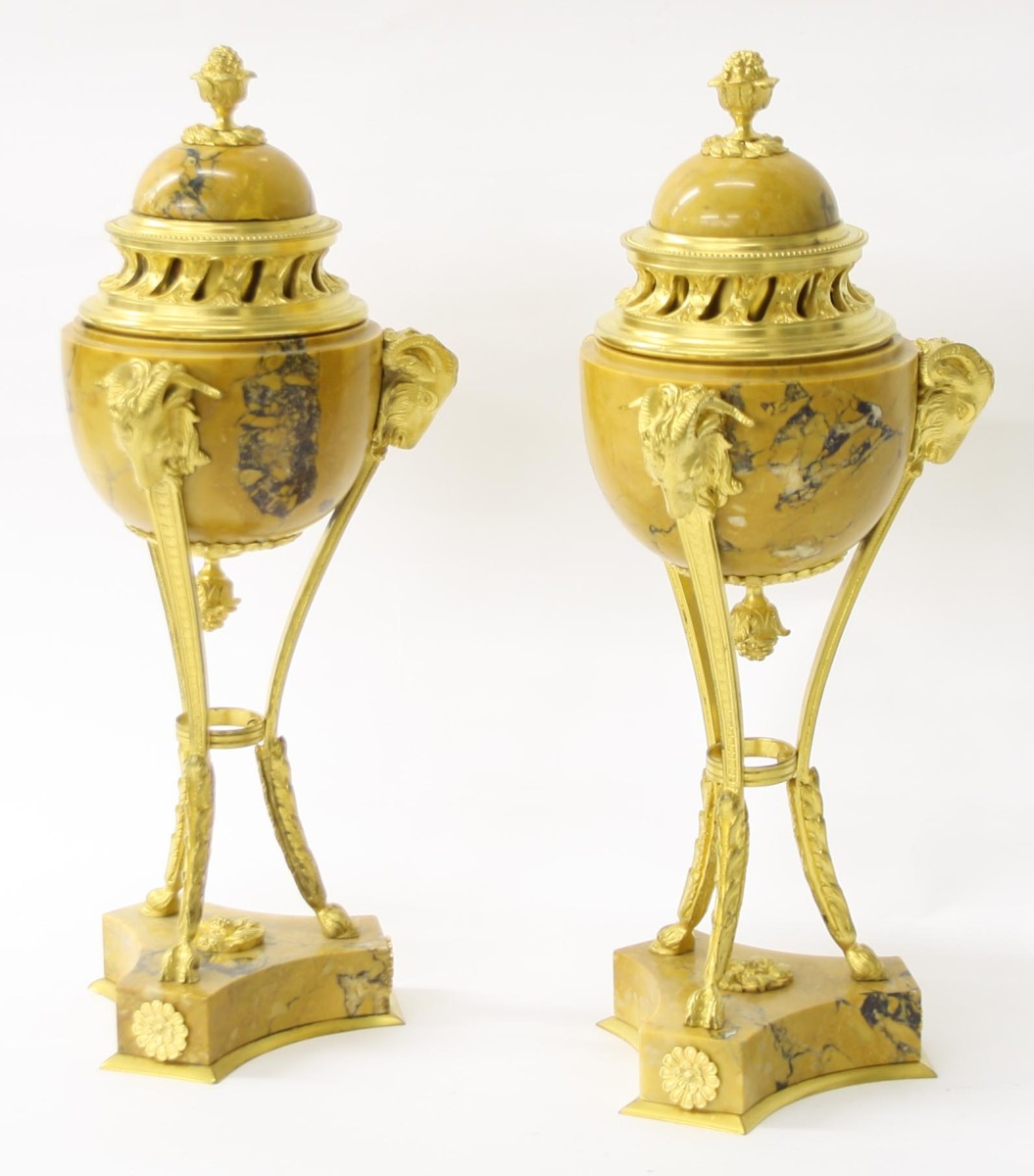 Attractive pair of French Sienna marble and ormolu cassolettes, with triple curving legs cast with