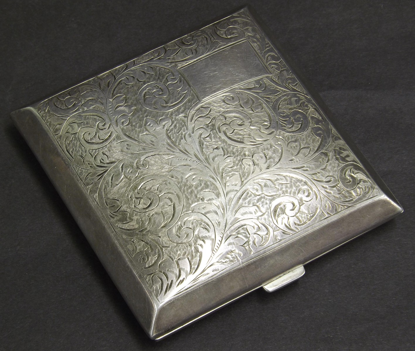 Floral engraved silver cigarette case, Birmingham 1932, 3oz approx