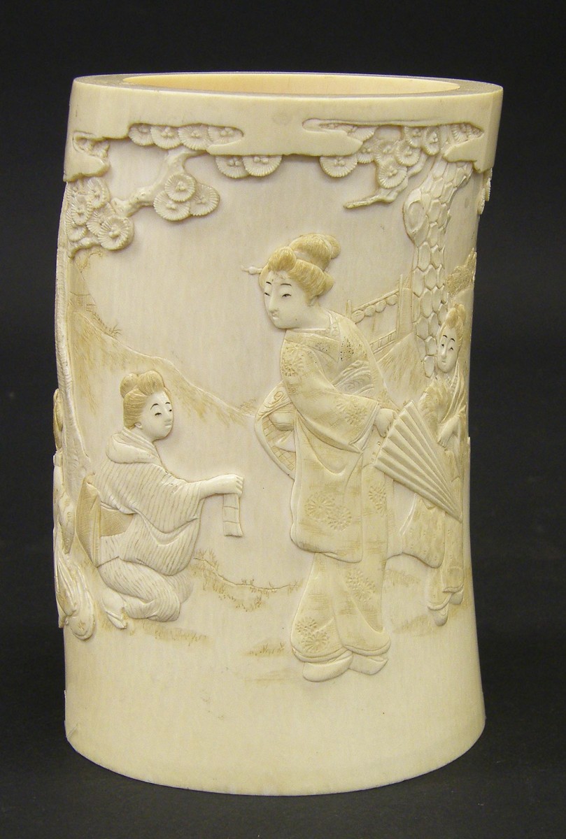 Chinese ivory tusk brush pot carved with figures in a garden setting, 6" high