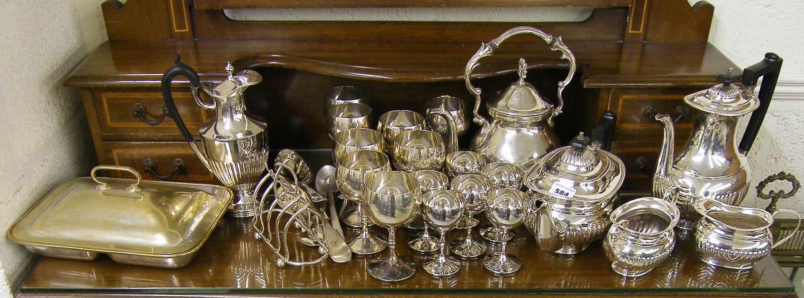 Collection of silver plated items to include four piece tea service, collection of goblets etc