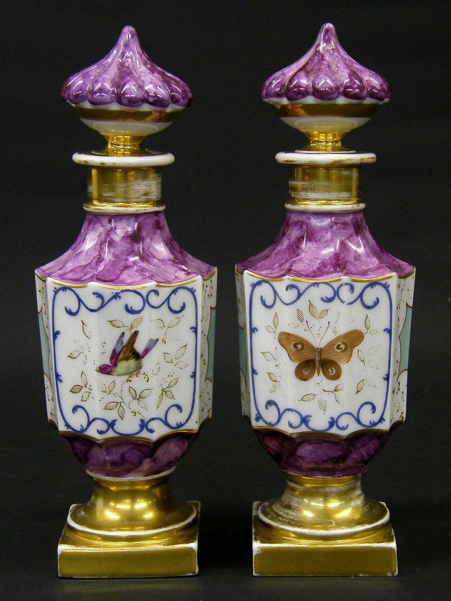 Pair of French 19th century porcelain faceted baluster scent bottles, painted with panels of birds