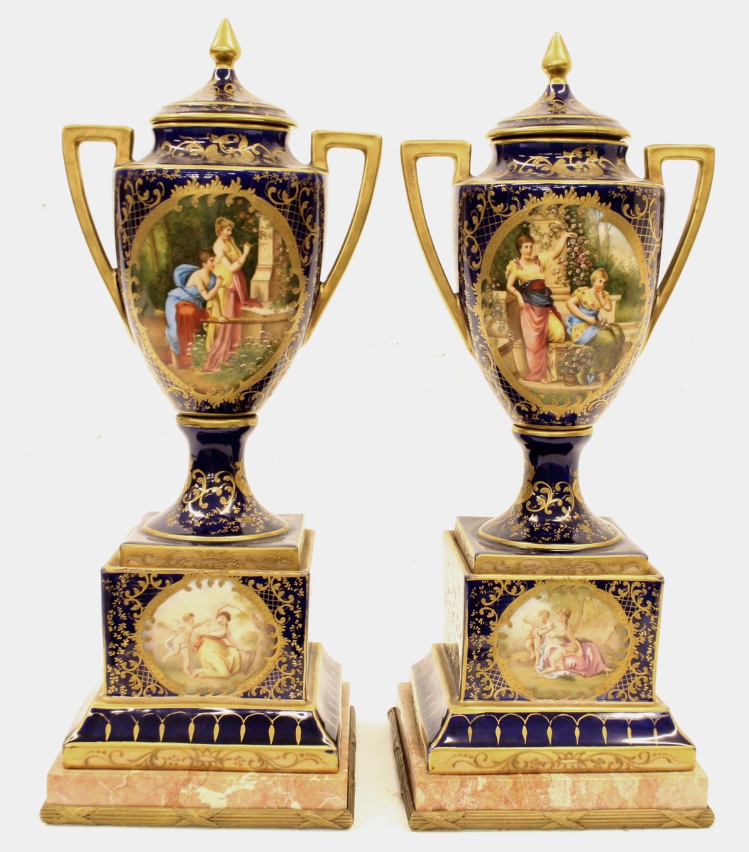 Fine pair of 19th century Vienna porcelain pedestal vases and covers, the panels painted with