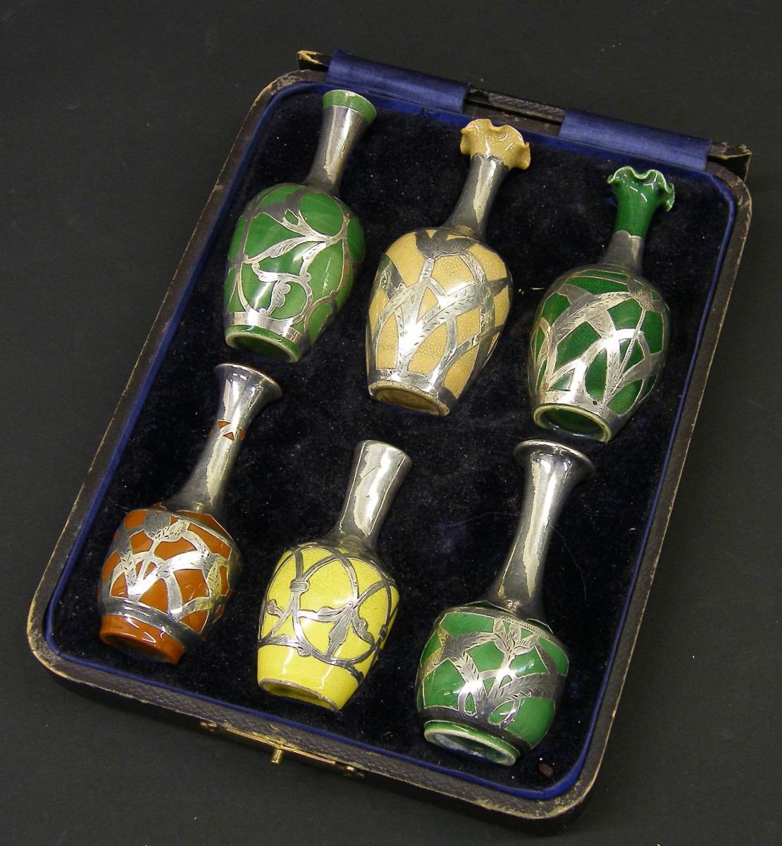 Cased set of six American miniature porcelain vases, with silver overlay, the largest 4" high (6)