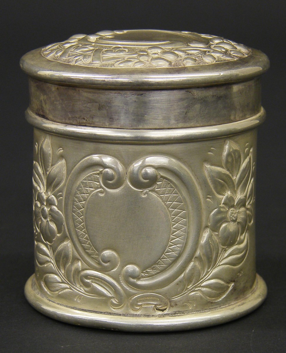 Victorian silver lidded cylindrical powder jar chased with cartouches and flowers, maker`s marks