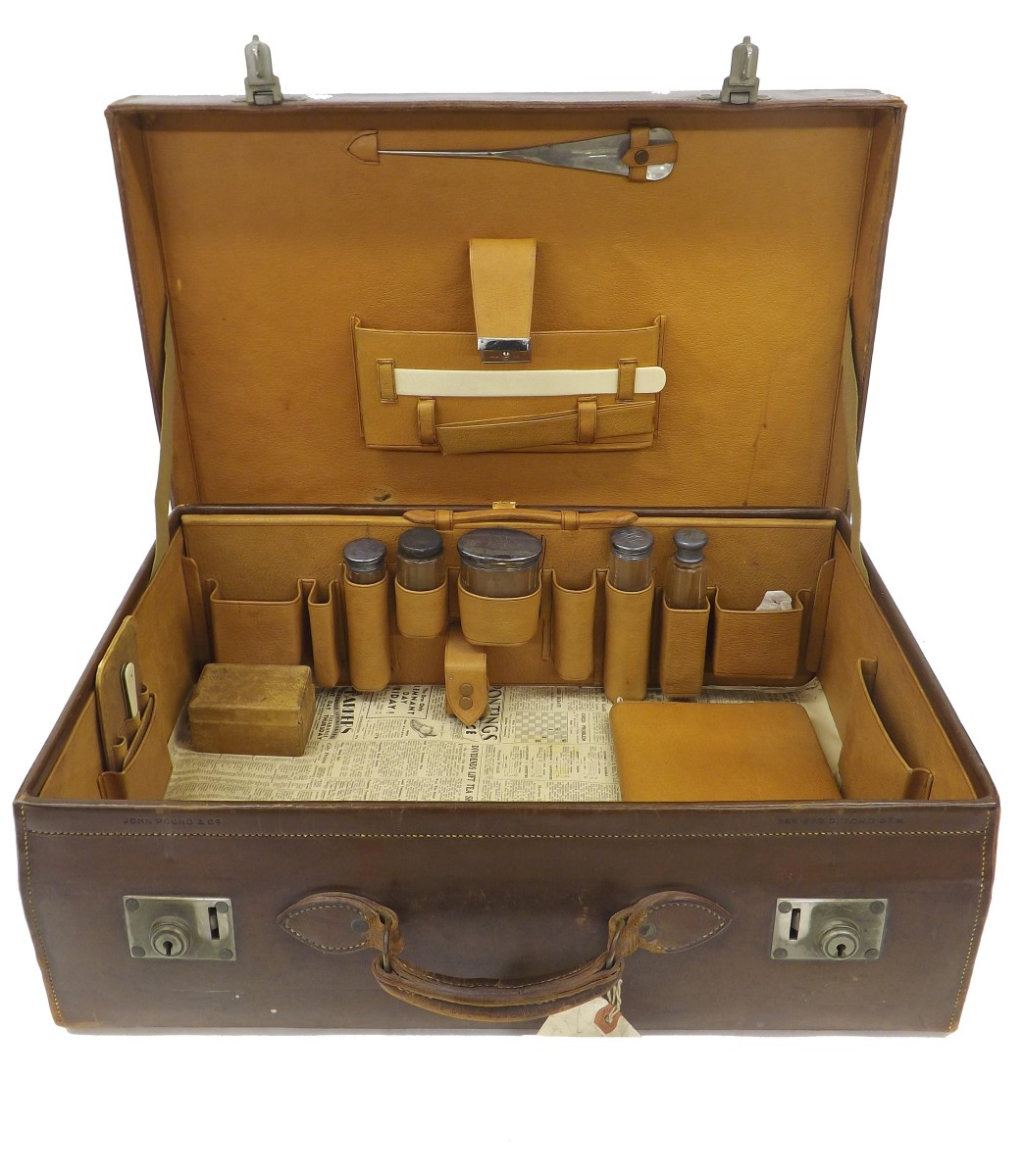 Part fitted leather vanity case with five silver topped bottles and various accessories