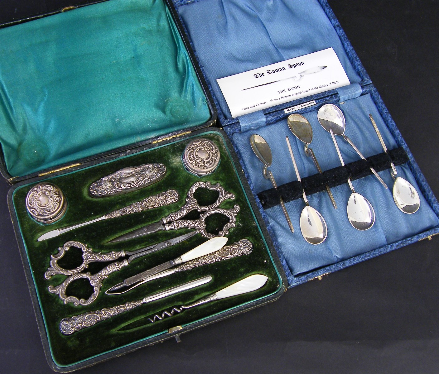 Attractive cased part fitted silver handled manicure set embossed with scrolling cartouches and