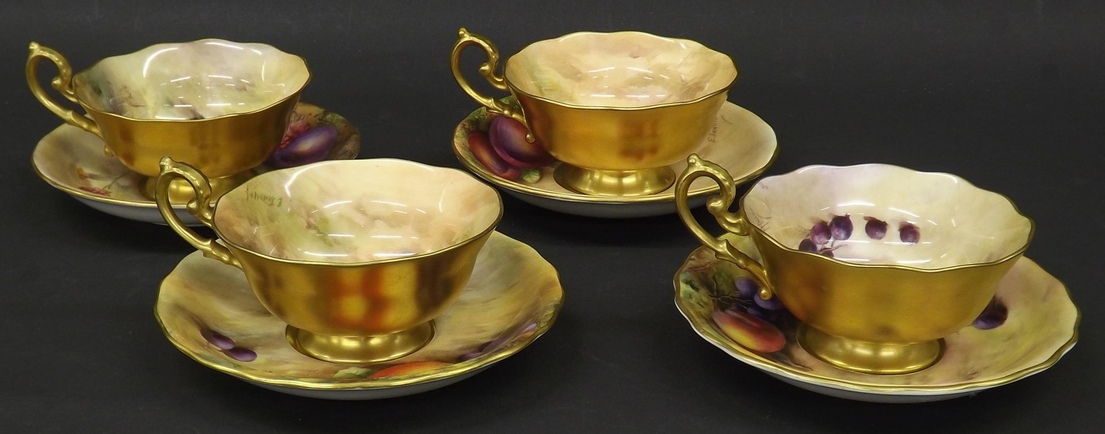 Four Royal Worcester porcelain fruit painted cups and saucers signed Pryce, Townsend & Aynton,