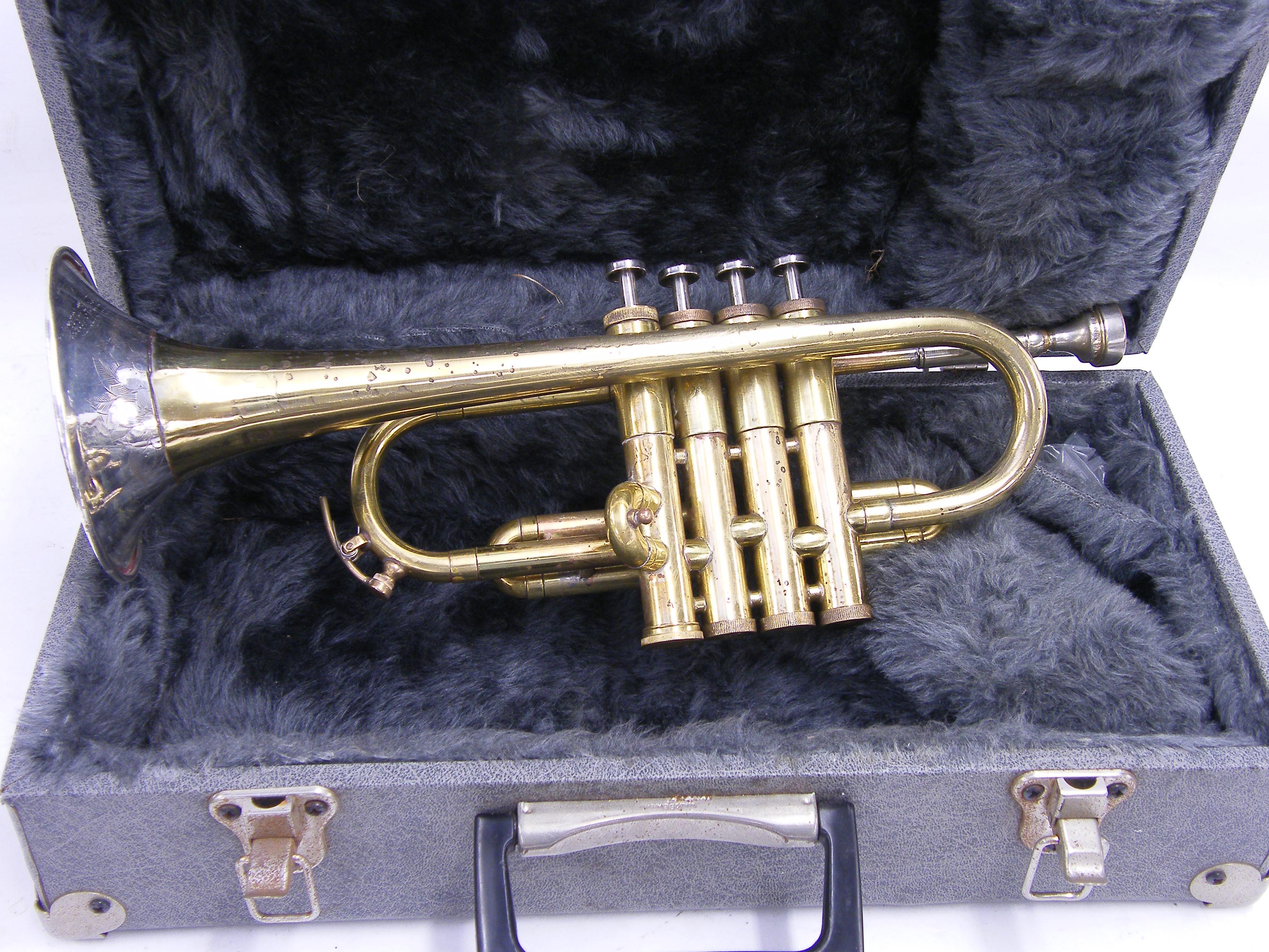 Unusual four valve E flat/D brass trumpet, made in England, possibly a prototype instrument, case