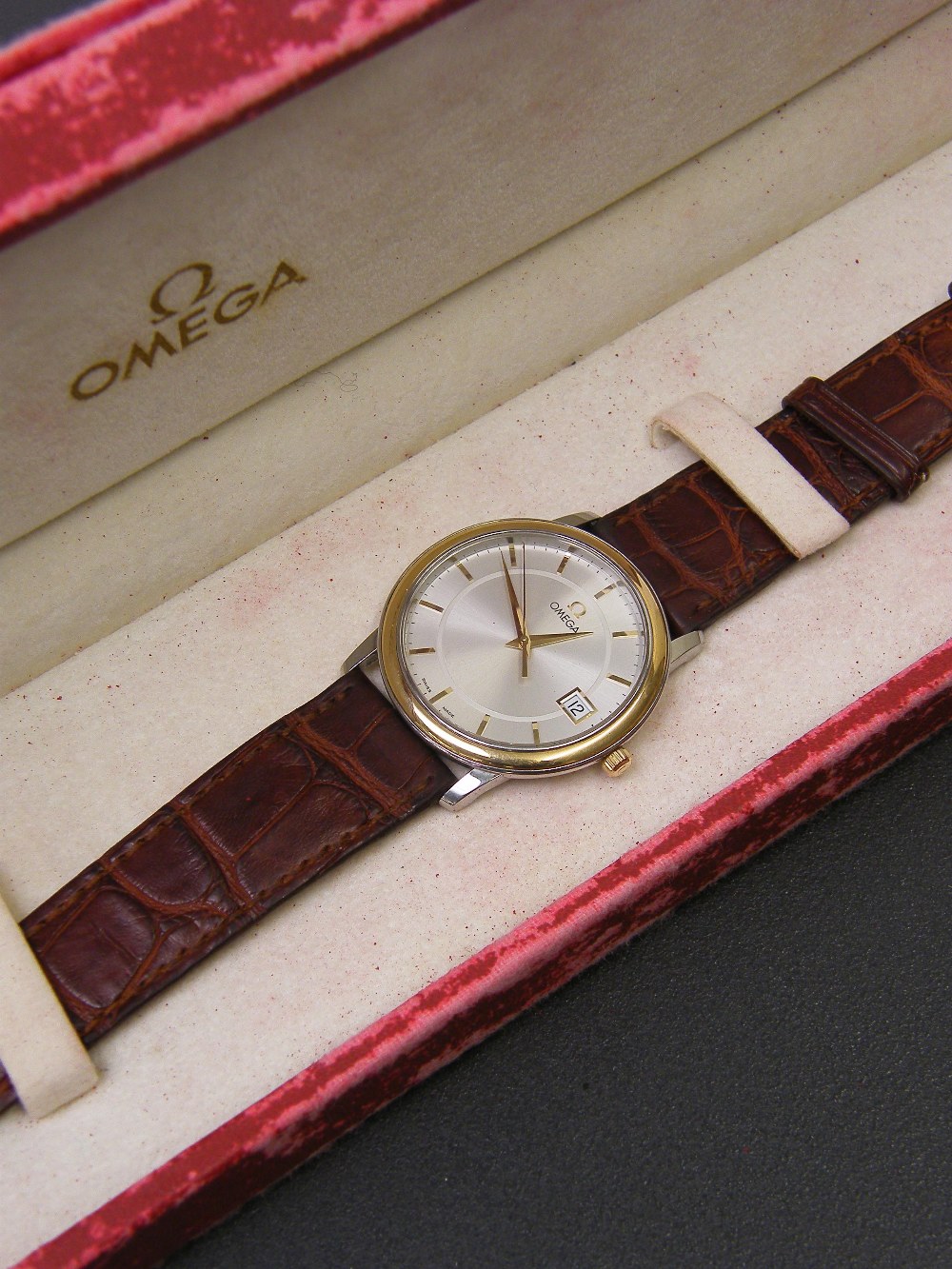 Omega steel and gold quartz gentleman`s dress wristwatch, the circular silvered dial with baton