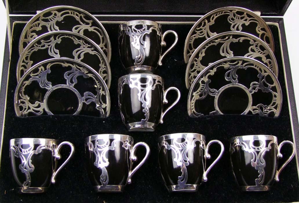 A set of six Rosenthal black and silver overlaid coffee cups and saucers, cased