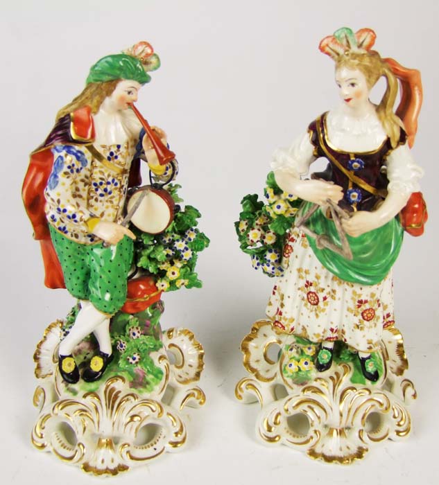 A pair of Derby figures of musicians, she playing the triangle, he the flageolet and tabor, on