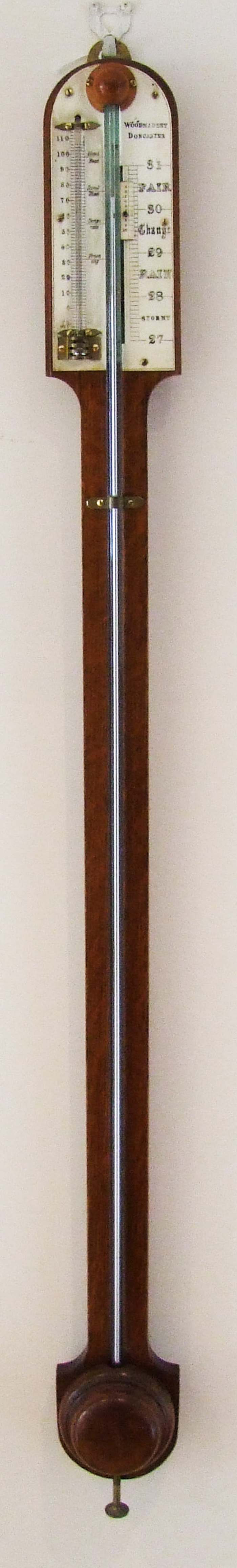 An oak stick barometer, the scale signed Woodmansey, Doncaster, height 89cm (35in).