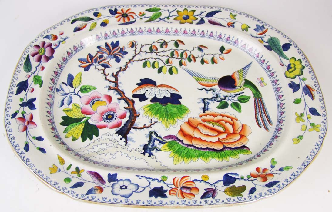 A 19th Century stone china plate, of canted rectangular form, decorated with a bird amidst flowers