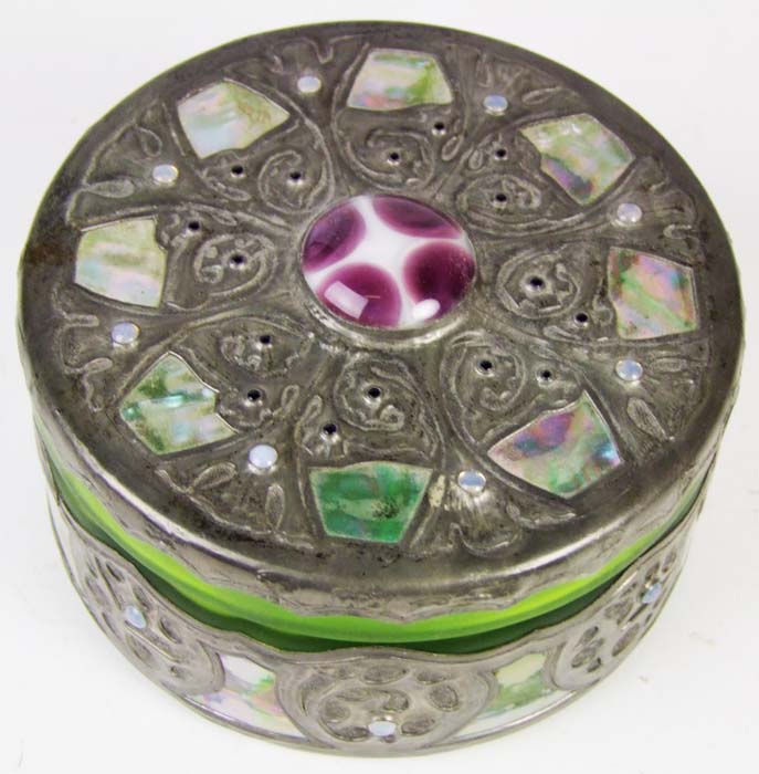 A green glass circular box, metal overlaid and inlaid with mother-o’-pearl, diameter 12cm (4 3/4in).