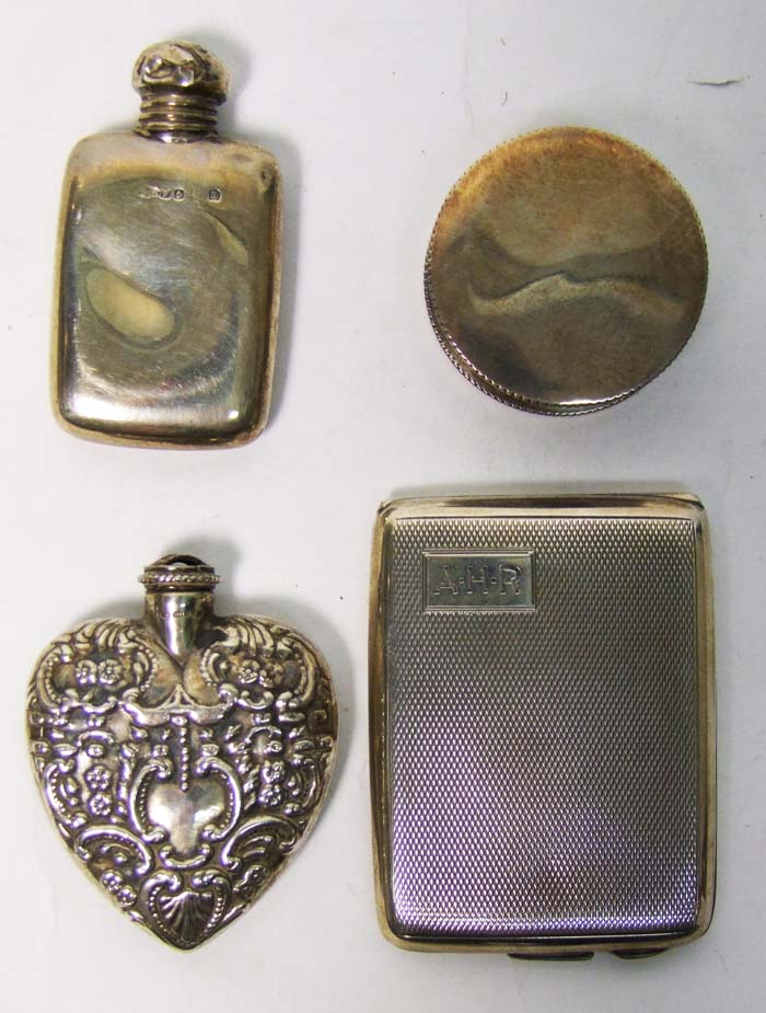 A Continental silver heart-shaped scent bottle, embossed with flowerheads and scrolls, import mark