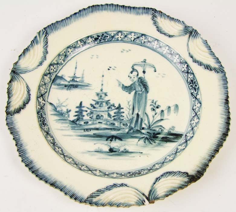 A Leeds creamware plate, with swag rim and decorated with a figure and pagodas, diameter 24cm (9 1/