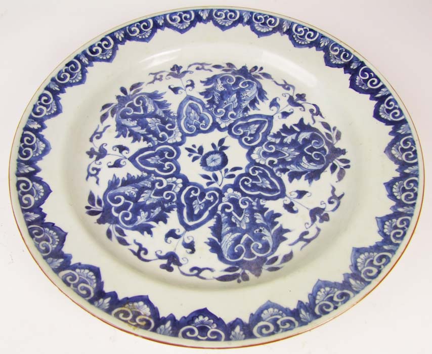 A 19th Century Chinese blue and white charger, the bowl and rim with leaf scrolls, diameter 39cm (15