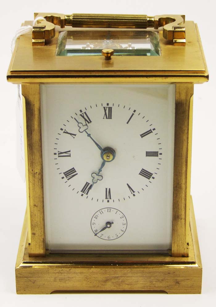 A French brass carriage clock, the white enamel dial with secondary alarm dial, height 14cm (5 1/