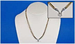Ladies 9ct Polished Yellow Gold Necklace with small cz pendant drop. Marked 375. 20 inches length.