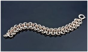 French Early 20th Century Silver Bracelet with gold highlights. 8 inches in length.