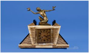Art Deco Spelter and Marble Mantel Clock, the gilt spelter female figure, in an Egyptianesque
