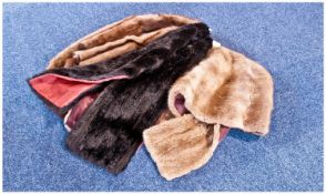 Three Various Fur Stoles comprising dark blonde musquash cape back stole, burgundy satin lining