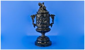 French Lidded Spelter Metal Vase, depicting putti drinking scenes in the classical manner. With