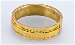 Late 19thC Broad Yellow Metal Bangle, The Front Surmounted With A Central Plain Bar Between Two